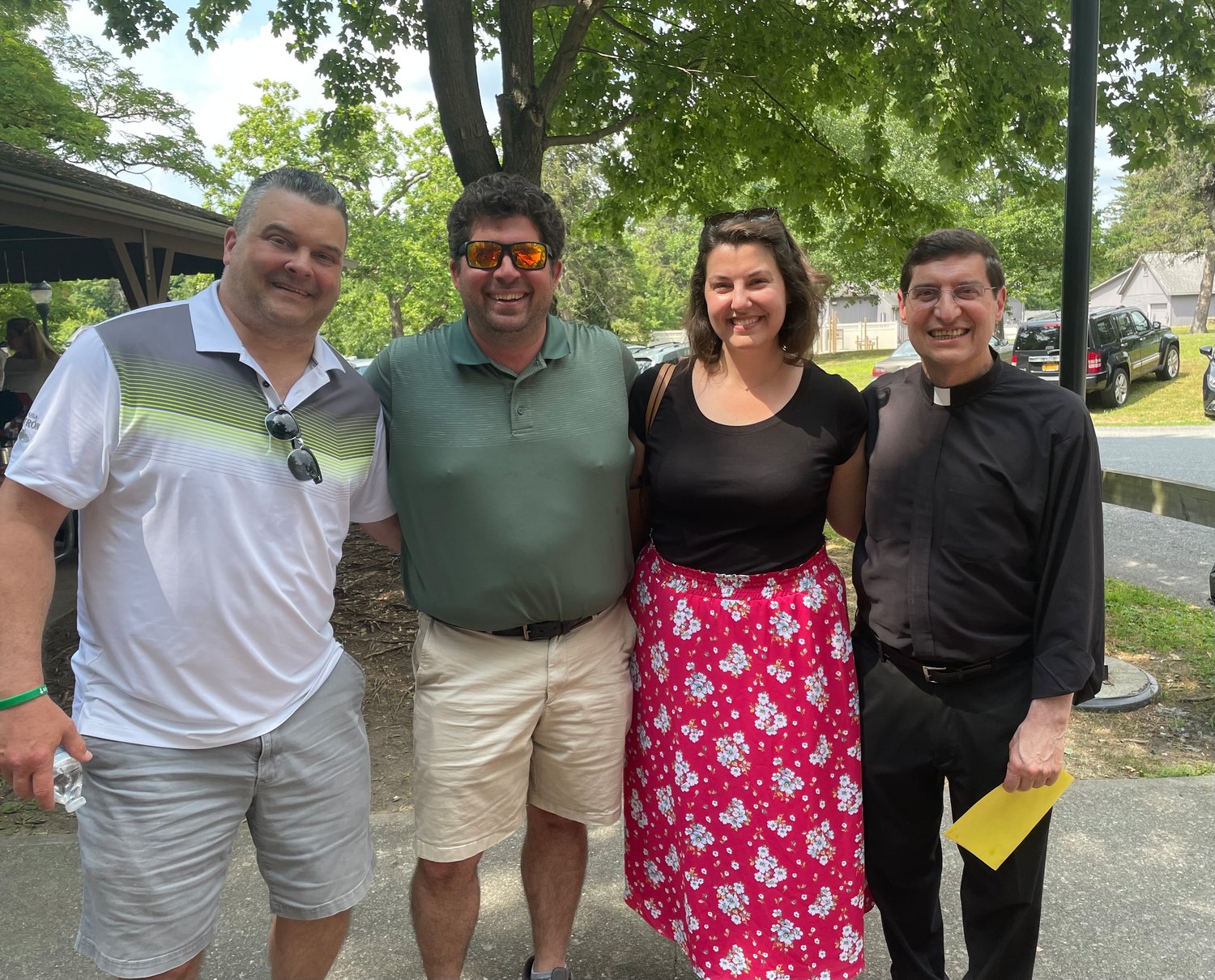 Msgr. Joseph Giandurco, pastor of St. Patrick’s, Yorktown Heights, spends time with parishioners at the parish’s annual picnic July 17 at Downing Park in Yorktown Heights.